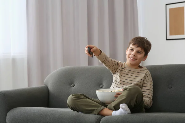 Little Boy Holding Bowl Popcorn Changing Channels Remote Control Sofa — Stock Photo, Image