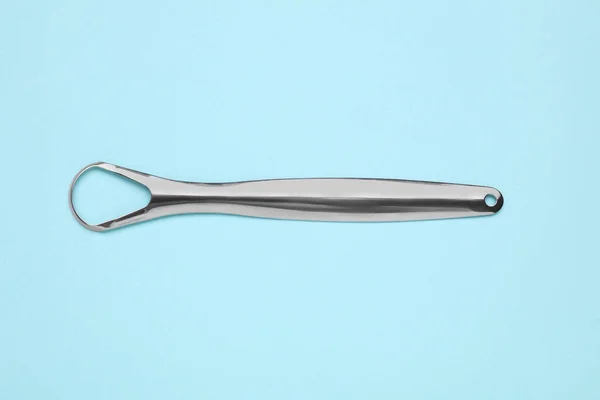 Metal Tongue Cleaner Light Blue Background Top View — Stock Photo, Image