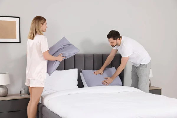 Couple Changing Bed Linens Room Domestic Chores Stock Image