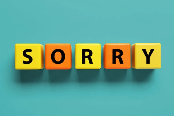 Apology Word Sorry Made Colorful Cubes Turquoise Background Top View — Stock Photo, Image