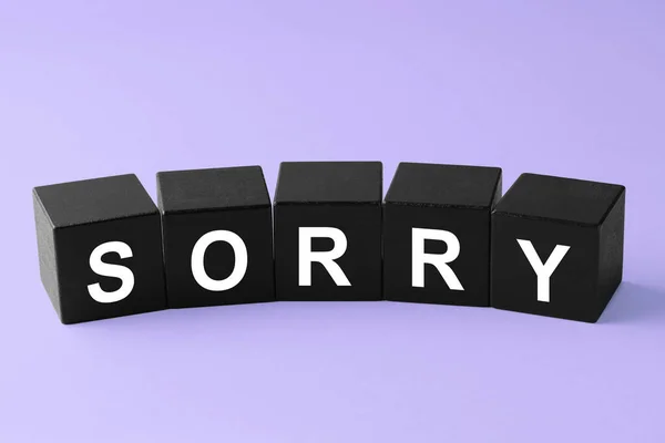 Apology Word Sorry Made Black Cubes Violet Background — Stock Photo, Image