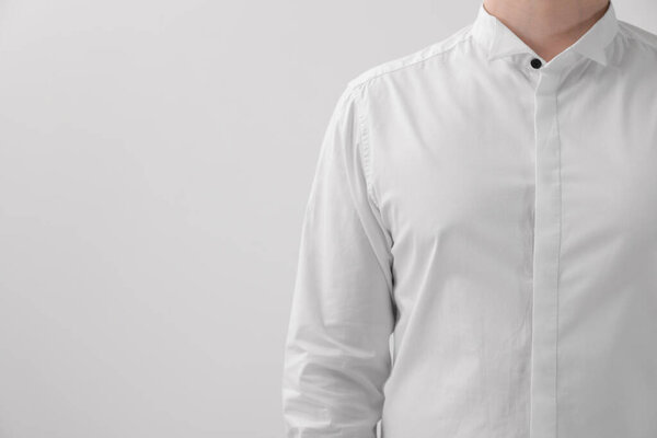 Man wearing classic shirt on white background, closeup