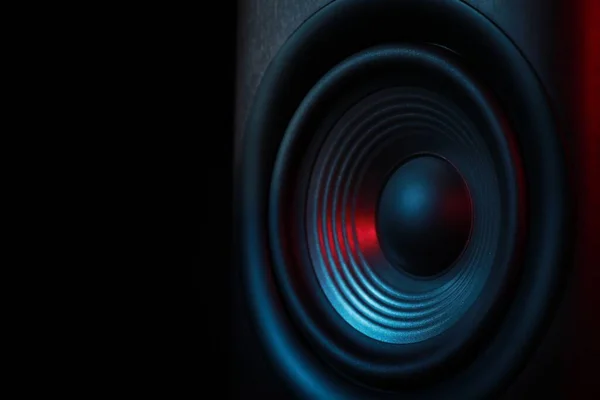 One sound speaker in neon light on black background, closeup. Space for text