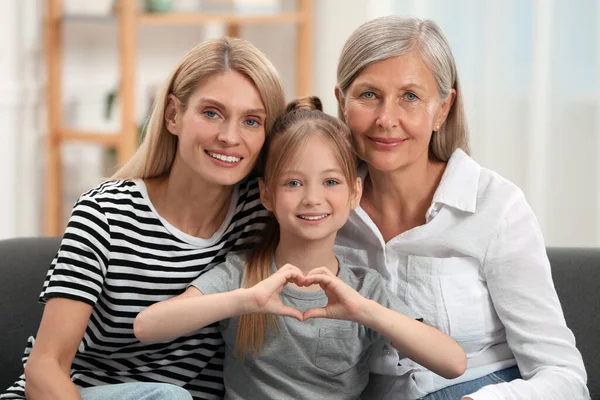 Three Generations Happy Grandmother Her Daughter Granddaughter Making Heart Hands — Stock Photo, Image