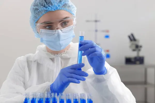 stock image Scientist holding test tube with sample in laboratory