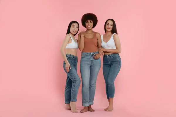 stock image Portrait of beautiful young women on pink background