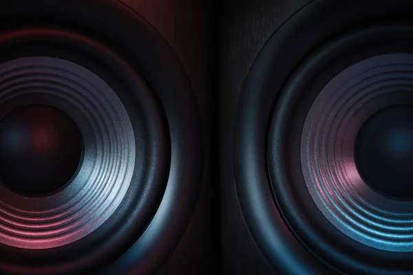 Modern sound speakers in neon light as background, closeup