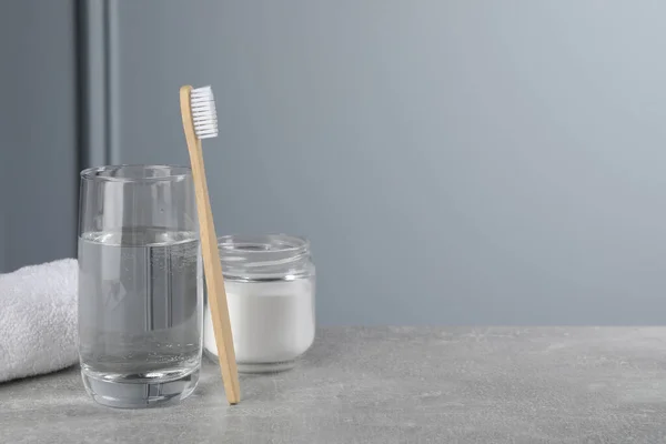 Bamboo Toothbrush Glass Water Jar Baking Soda Light Grey Table — Stock Photo, Image