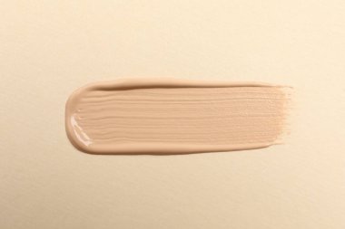 Bej arka plan, üst görünüm cilt temeli lekesi