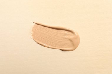 Bej arka plan, üst görünüm cilt temeli lekesi