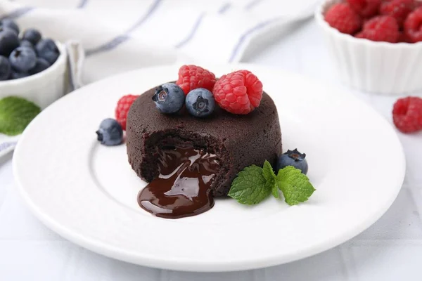 Plate Delicious Chocolate Fondant Berries Mint White Tiled Table Closeup — Stock Photo, Image