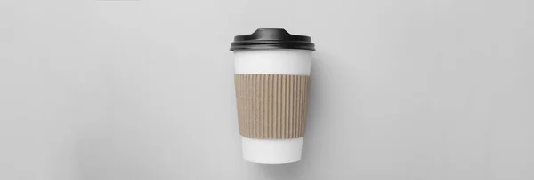 To-go drink. Paper coffee cup on white background, top view. Banner design