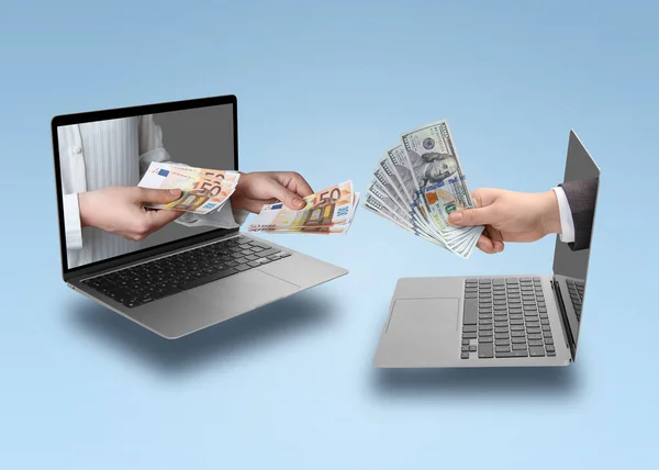 Online money exchange. Man with dollars and woman holding euro banknotes, closeup. Hands sticking out of laptops on color background