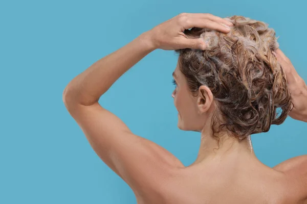 Woman Washing Hair Light Blue Background Back View — Stock Photo, Image