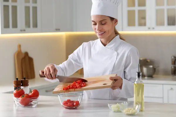 Professional Chef Putting Cut Tomatoes Bowl White Marble Table Indoors — Stock Photo, Image