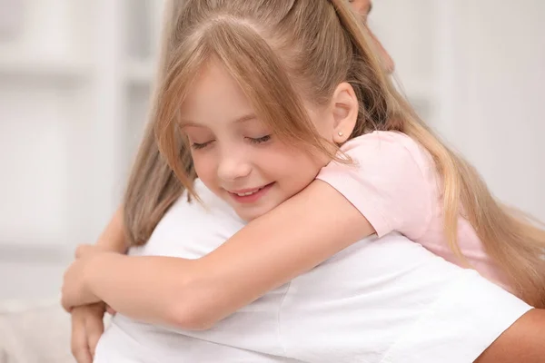 Little Girl Hugging Her Grandmother Blurred Background Closeup — Stock Photo, Image