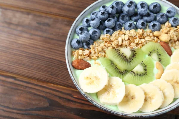 Tasty Smoothie Bowl Fresh Fruits Oatmeal Wooden Table Closeup Space — Stock Photo, Image