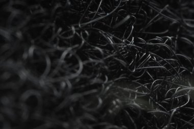 Arkaplan olarak siyah kanca ve ilmek hızlandırıcı, yakın görüntü