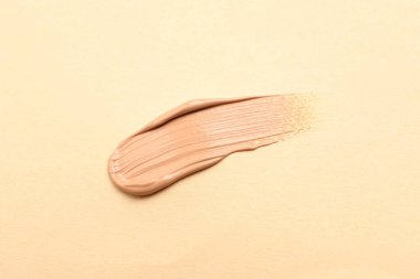 Bej arka plan, üst görünüm cilt temeli lekesi