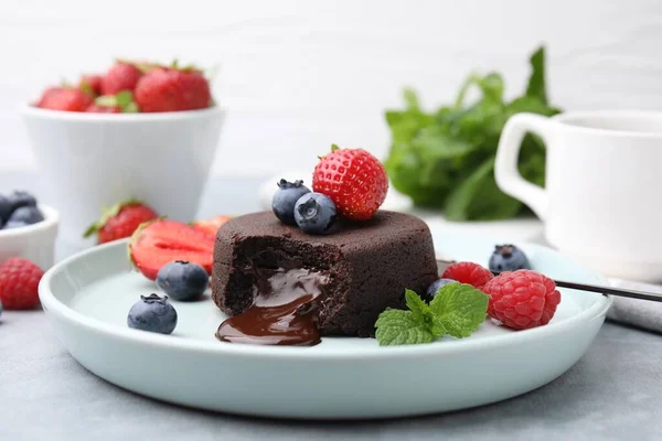 Plate Delicious Chocolate Fondant Berries Mint Grey Table Closeup — Stock Photo, Image