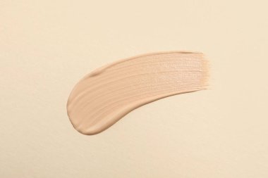 Bej arka plan, üst görünüm cilt temeli lekesi