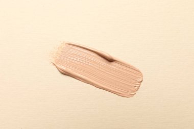 Bej arka plan, üst görünüm cilt temeli lekesi