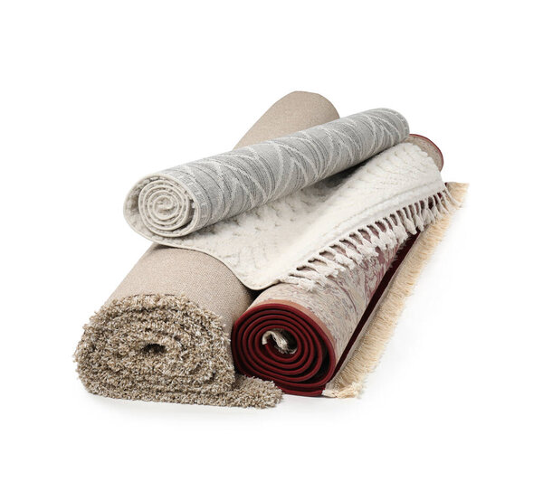 Rolled carpets on white background. Interior element
