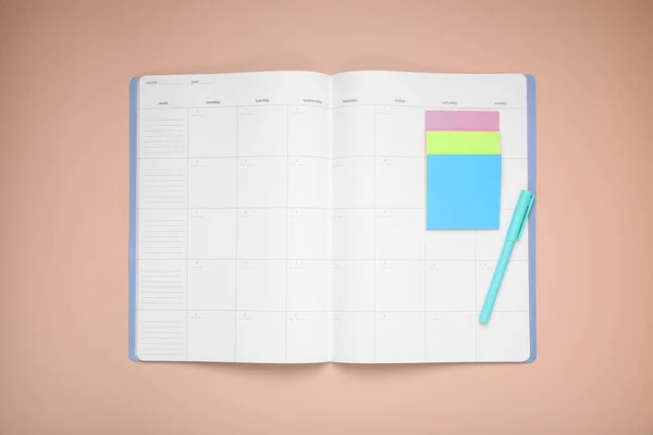 Open Monthly Planner Blank Sticky Notes Pen Beige Background Top — Stock Photo, Image