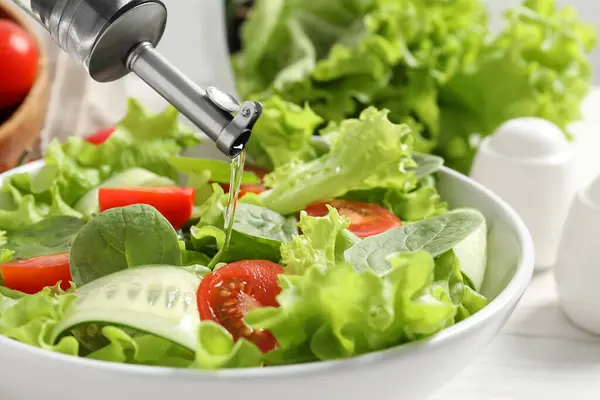 Pouring Oil Delicious Vegetable Salad White Table Closeup — Stock Photo, Image