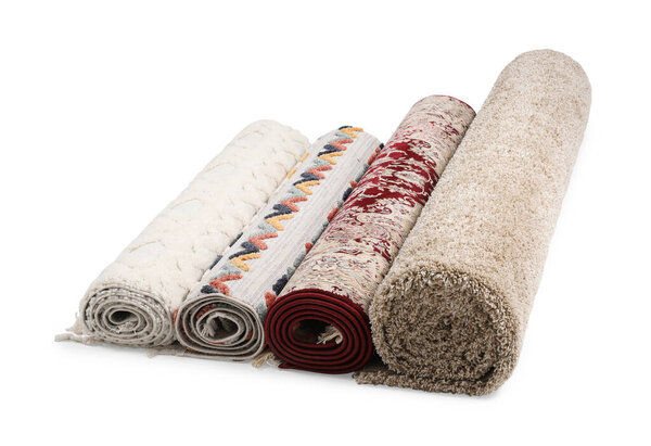 Rolled carpets on white background. Interior element
