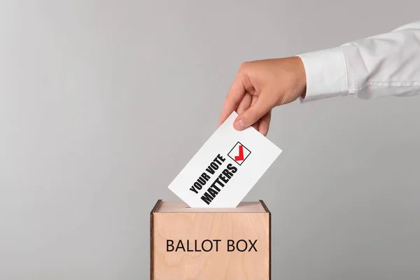 Man Putting Paper Text Your Vote Matters Tick Ballot Box — Fotografia de Stock