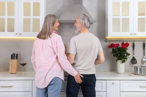 stock image Affectionate senior couple spending time together in kitchen
