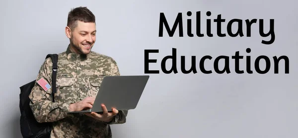 Military education. Cadet with backpack and laptop on light grey background