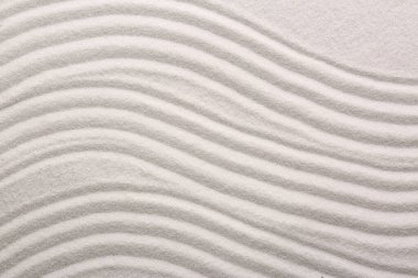 Beyaz kum, arka plan olarak desenli, üst görünüm. Zen ve uyum kavramı