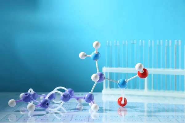 Molecular Model Test Tubes Periodic Table Light Blue Background — Stock Photo, Image