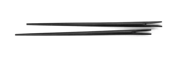 Ζεύγος Μαύρων Chopsticks Που Απομονώνονται Λευκή Κορυφαία Προβολή — Φωτογραφία Αρχείου
