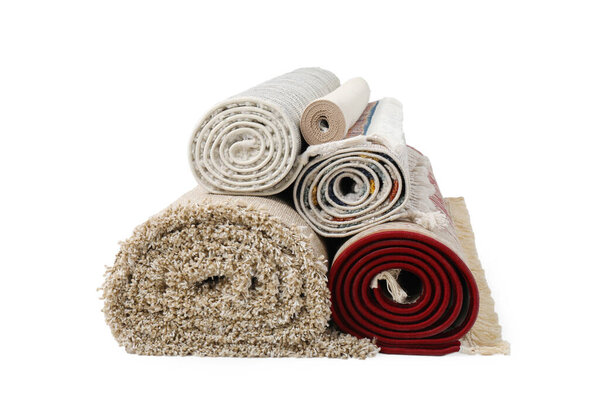 Rolled carpets on white background. Interior element