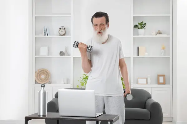 Senior Man Exercising Dumbbells While Watching Online Tutorial Home Sports — Stock Photo, Image