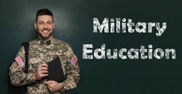 Military education. Cadet with backpack and tablet near green chalkboard
