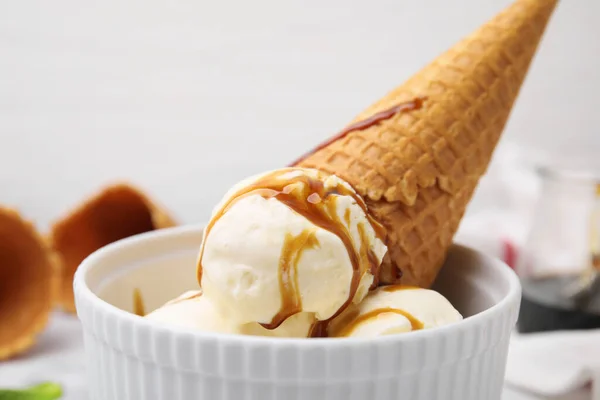 Scoops Ice Cream Caramel Sauce Wafer Cone Bowl Closeup — Stock Photo, Image