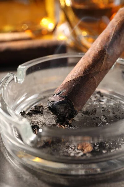 Ashtray Smoldering Cigar Grey Table Closeup — Stock Photo, Image