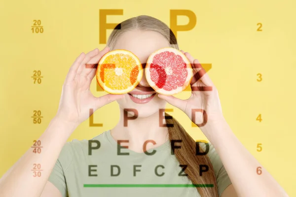 Improving eyesight. Vision test chart and photo of woman with citrus fruits near eyes on yellow background, double exposure