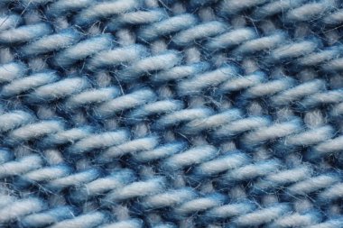 Arka plan olarak mavi desenli kumaşın makro fotoğrafı