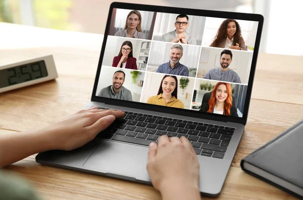 stock image Woman participating in webinar via laptop at table, closeup