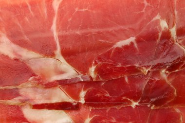 Arka plan olarak lezzetli dilimlenmiş jamon, üst görünüm