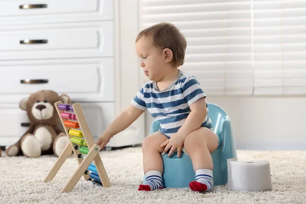 Little Child Abacus Sitting Plastic Baby Potty Indoors — Stock Photo, Image
