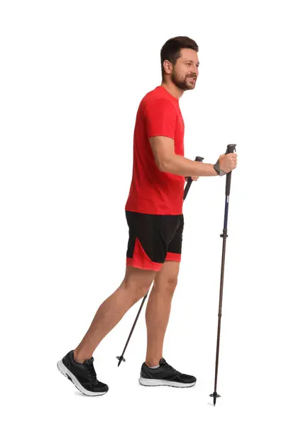 Muž Cvičit Nordic Walking Tyčemi Izolované Bílém — Stock fotografie