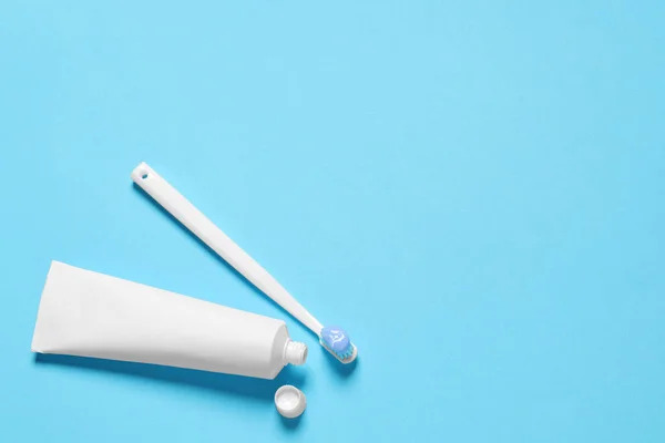 Plastic Toothbrush Paste Tube Light Blue Background Flat Lay Space — Stock Photo, Image