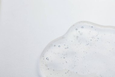Bej arka planda kozmetik yağı örneği, yakın plan. Metin için boşluk