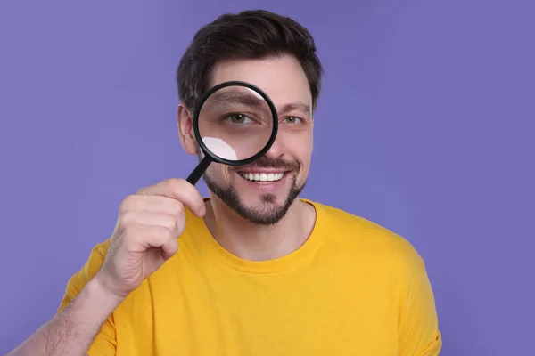 Happy Man Looking Magnifier Glass Purple Background — Stock Photo, Image
